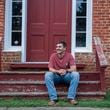 Army veteran Edward Robertson poses for a portrait in downtown Homer, at the Old Courthouse on Oct. 1, 2024. (Olivia Bowdoin for the AJC).