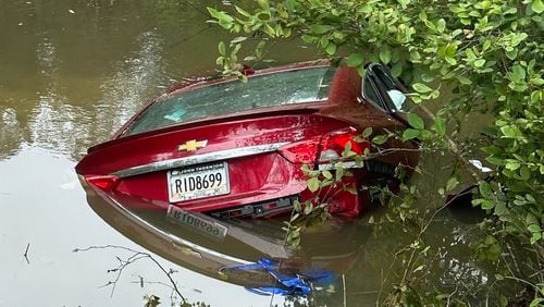 A Paulding County woman was able to break a window after her car went into a pond in her yard. Two deputies quickly arrived to help free her.