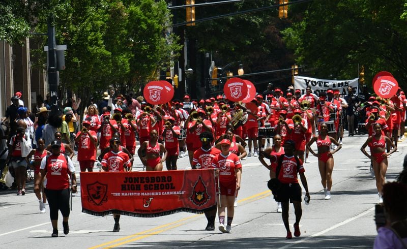 The Juneteenth Atlanta Black History Parade makes its way into Centennial Olympic Park in Atlanta on Saturday, June 18, 2022. (Hyosub Shin/The Atlanta Journal-Constitution)