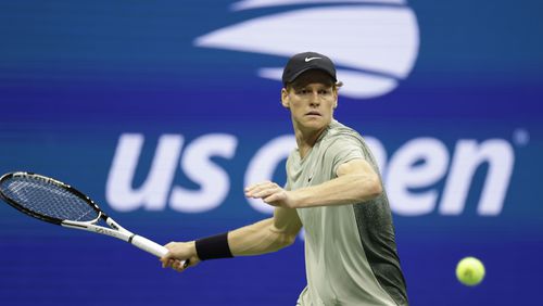 Jannik Sinner, of Italy, returns a shot to Tommy Paul, of the United States, during a fourth round match of the U.S. Open tennis championships, Monday, Sept. 2, 2024, in New York. (AP Photo/Adam Hunger)