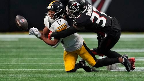 Atlanta Falcons safety Justin Simmons (31) breaks up a pass intended for Pittsburgh Steelers wide receiver Calvin Austin III (19) during the second half of an NFL football game Sunday, Sept. 8, 2024, in Atlanta. (AP Photo/John Bazemore)