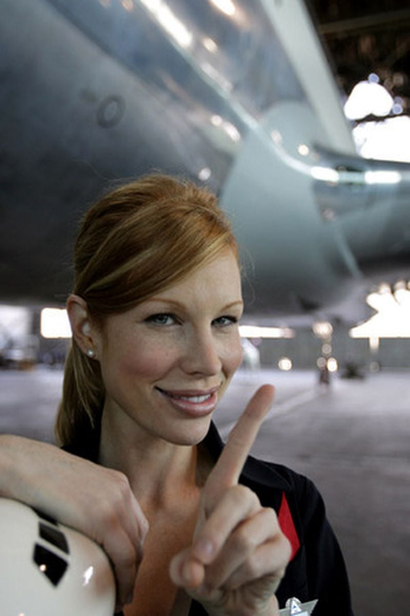 Katherine Lee, known across the YouTube universe as 'Deltalina,' reprises her role in the Delta Museum near their Hapeville headquarters in late March 2008. She has become somewhat of a celebrity because of Delta's new safety video in which Lee wags her finger at fliers.