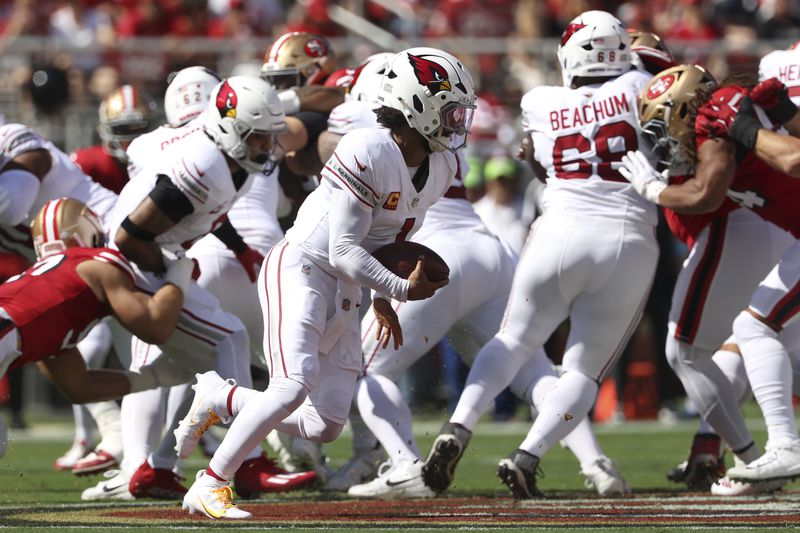 Arizona Cardinals quarterback Kyler Murray, middle, runs for a touchdown during the first half of an NFL football game against the San Francisco 49ers in Santa Clara, Calif., Sunday, Oct. 6, 2024. (AP Photo/Jed Jacobsohn)