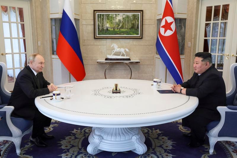 Russian President Vladimir Putin, left, and North Korea's leader Kim Jong Un talk to each other during their tete-a-tete meeting in Pyongyang, North Korea, on Wednesday, June 19, 2024. (Gavriil Grigorov, Sputnik, Kremlin Pool Photo via AP)