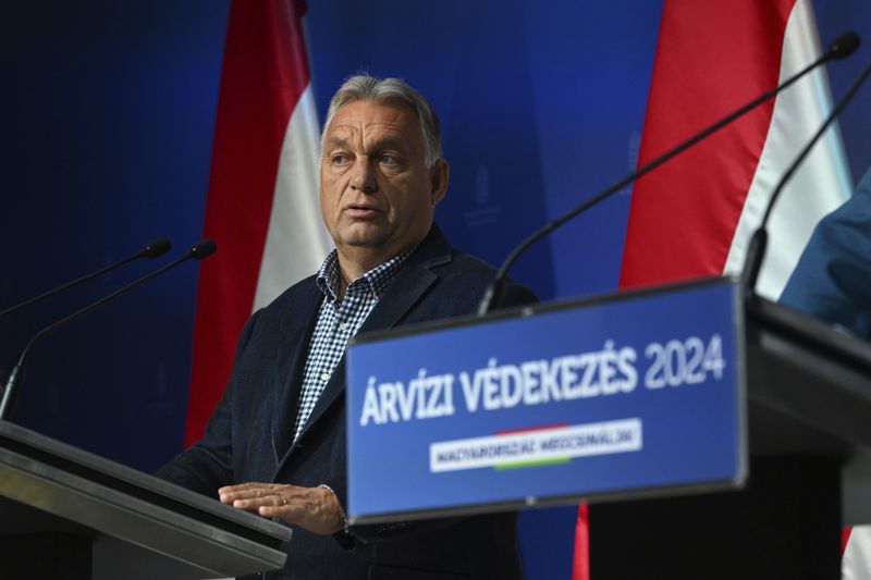 Hungarian Prime Minister Viktor Orban holds a news briefing on flood protection developments in the press room of the Prime Minister's Cabinet Office in Budapest, Hungary, Thursday, Sept. 19, 2024. (Szilard Koszticsak/MTI via AP)