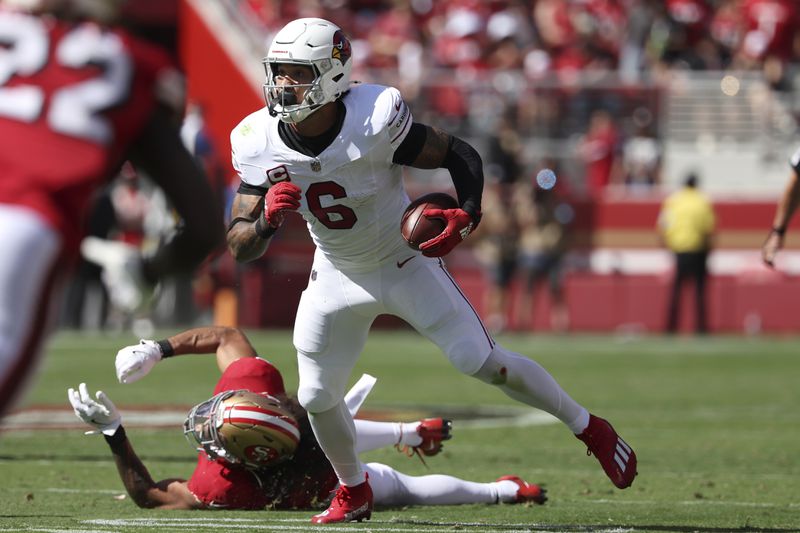 Arizona Cardinals running back James Conner (6) runs against the San Francisco 49ers during the first half of an NFL football game in Santa Clara, Calif., Sunday, Oct. 6, 2024. (AP Photo/Jed Jacobsohn)