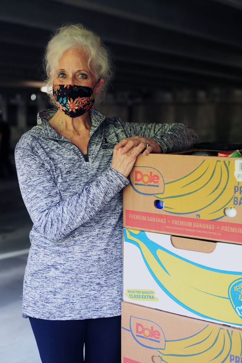 Maria Brunner, head of Musically Fed, poses for a photo during the Musically Fed food drive Oct. 29 at the Infinite Energy Center in Duluth. CHRISTINA MATACOTTA FOR THE AJC
