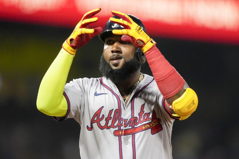 Atlanta Braves designated hitter Marcell Ozuna gestures after hitting a single during the seventh inning of a baseball game against the Los Angeles Angels, Saturday, Aug. 17, 2024, in Anaheim, Calif. (AP Photo/Ryan Sun)