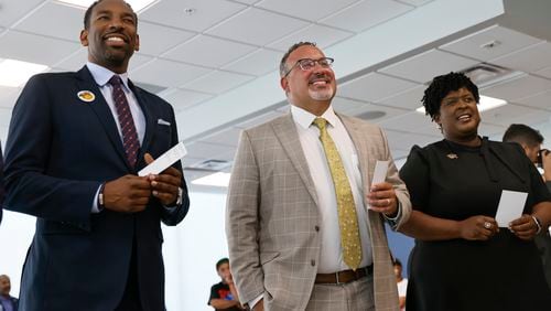 (Left to Right) Atlanta Mayor Andre Dickens, U.S. Secretary of Education Miguel Cardona and Atlanta Public Schools Superintendent Lisa Herring play a game with students in the Atlanta Teen Leaders Academy at The Martin Luther King Jr. Recreation and Aquatic Center on Tuesday, June 21, 2022. (Natrice Miller / natrice.miller@ajc.com)


