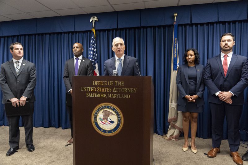 Assistant Attorney General for National Security Matthew G. Olsen, center, speaks during a news conference at the Office of the United States Attorney in Baltimore, Thursday, Sept. 5, 2024. (AP Photo/Stephanie Scarbrough)