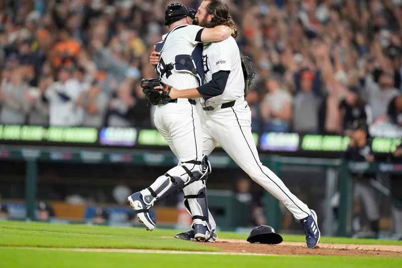 Detroit Tigers catcher Jake Rogers, left, and relief pitcher Jason Foley celebrate after the ninth inning of a baseball game against the Chicago White Sox, Friday, Sept. 27, 2024, in Detroit. (AP Photo/Carlos Osorio)