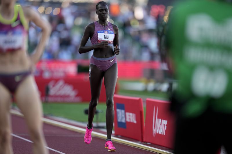 Athing Mu is in last place after falling in the women's 800-meter final during the U.S. Track and Field Olympic Team Trials Monday, June 24, 2024, in Eugene, Ore. (AP Photo/George Walker IV)