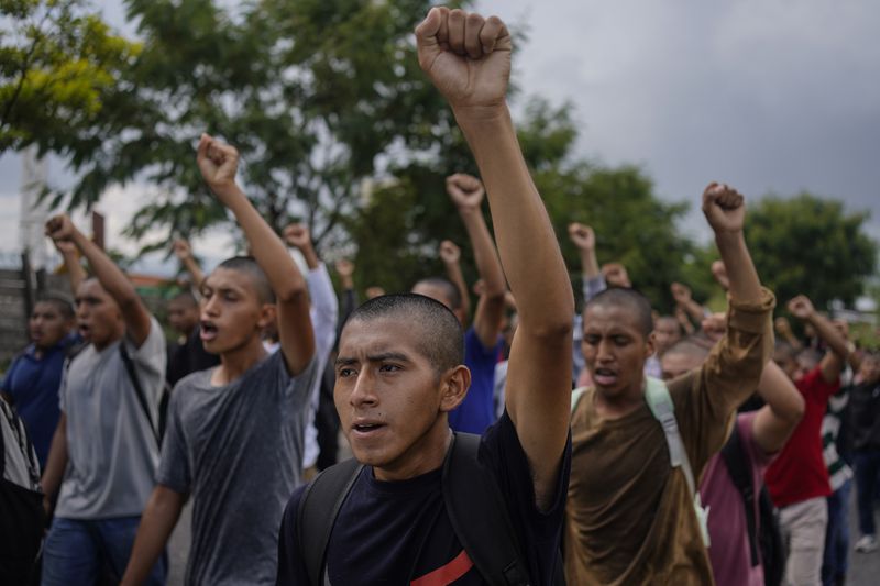 Classmates of the 43 Ayotzinapa students who went missing almost 10 years ago march to demand justice for their loved ones in Chilpancingo, Mexico, Wednesday, Sept. 18, 2024. (AP Photo/Felix Marquez)