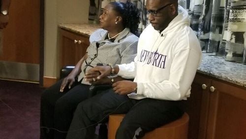 Dorothy Malcome and the Rev. Jamal Harrison Bryant, senior pastor of New Birth Missionary Baptist Church. Malcome had $3,000 in medical debt eliminated. CONTRIBUTED