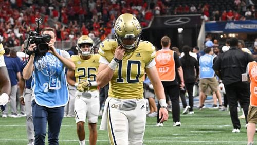 Georgia Tech's quarterback Haynes King (10) leaves the football field after Louisville defeat Georgia Tech during the inaugural Aflac Kickoff Game at Mercedes-Benz Stadium, Friday, September 1, 2023, in Atlanta. Louisville won 39-34 over Georgia Tech. (Hyosub Shin / Hyosub.Shin@ajc.com)