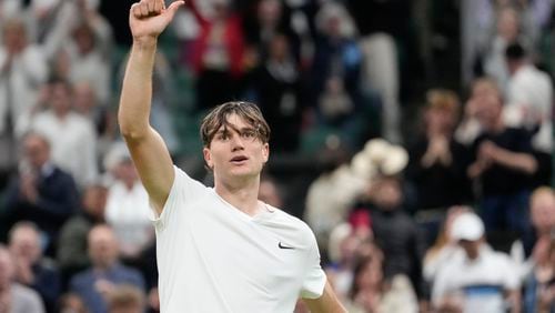 Jack Draper of Britain celebrates after defeating Elias Ymer of Sweden in their first round match at the Wimbledon tennis championships in London, Tuesday, July 2, 2024. (AP Photo/Alberto Pezzali)
