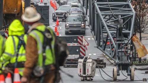 Traffic backs up on Spring Street where a construction crane is blocking the road and causing major traffic headaches. (John Spink / John.Spink@ajc.com)