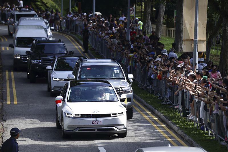 Pope Francis and entourage leave St Theresa's Home in Singapore, Friday, Sept. 13, 2024. (AP Photo/Suhaimi Abdullah)