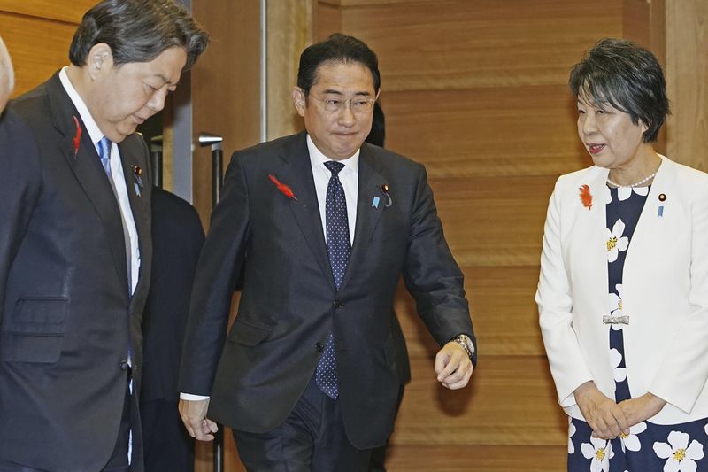 Japan’s Prime Minister Fumio Kishida, center, attends a Cabinet meeting at his office in Tokyo before his resignation Tuesday, Oct. 1, 2024. (Kyodo News via AP)