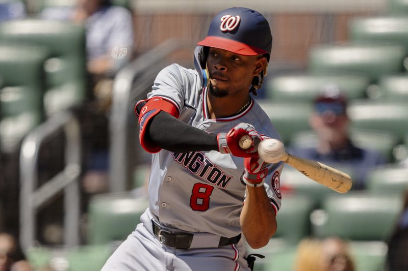 Washington Nationals' José Tena (8) watches a pitch go by called strike in the third inning of a baseball game against the Atlanta Braves, Sunday, Aug. 25, 2024, in Atlanta. (AP Photo/Jason Allen)