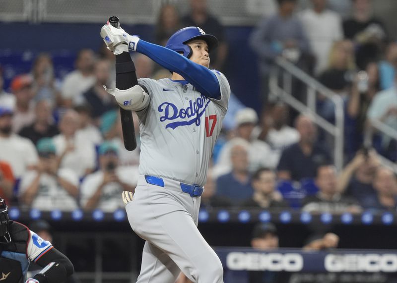 Los Angeles Dodgers' Shohei Ohtani (17) hits a two-run home run during the third inning of a baseball game against the Miami Marlins, Tuesday, Sept. 17, 2024, in Miami. (AP Photo/Marta Lavandier)