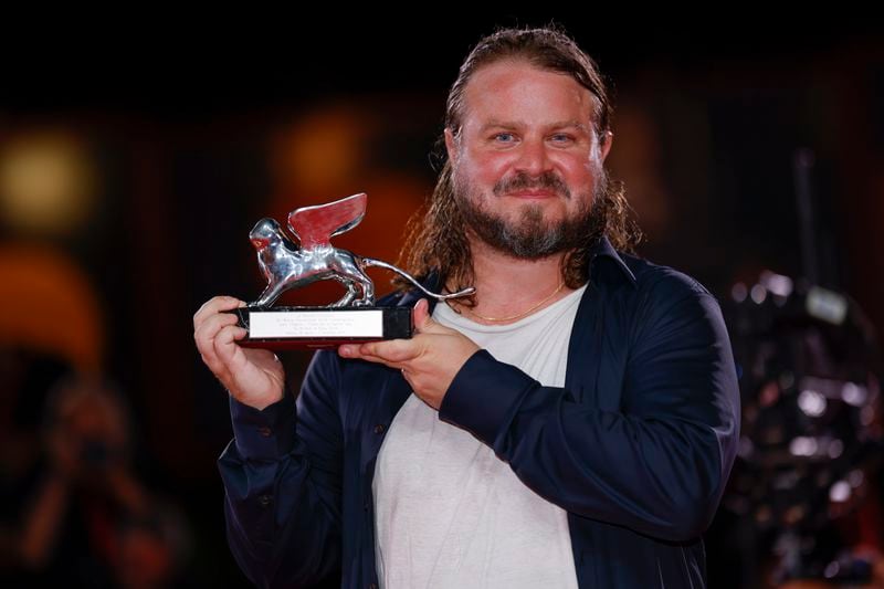 Brady Corbet, winner of the silver lion for best director for the film 'The Brutalist', poses for photographers at the awards photo call during the closing ceremony of the 81st edition of the Venice Film Festival in Venice, Italy, on Saturday, Sept. 7, 2024. (Photo by Vianney Le Caer/Invision/AP)