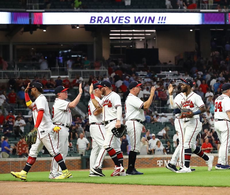 081822 Atlanta: Atlanta Braves outfielder Michael Harris (far right) and teammates celebrate a 3-2 victory over the New York Mets to win the series in a MLB baseball game on Thursday, August 18, 2022, in Atlanta.   “Curtis Compton / Curtis Compton@ajc.com