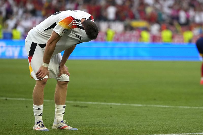 Germany's Florian Wirtz reacts at the end of a quarter final match between Germany and Spain at the Euro 2024 soccer tournament in Stuttgart, Germany, Friday, July 5, 2024. (AP Photo/Matthias Schrader)