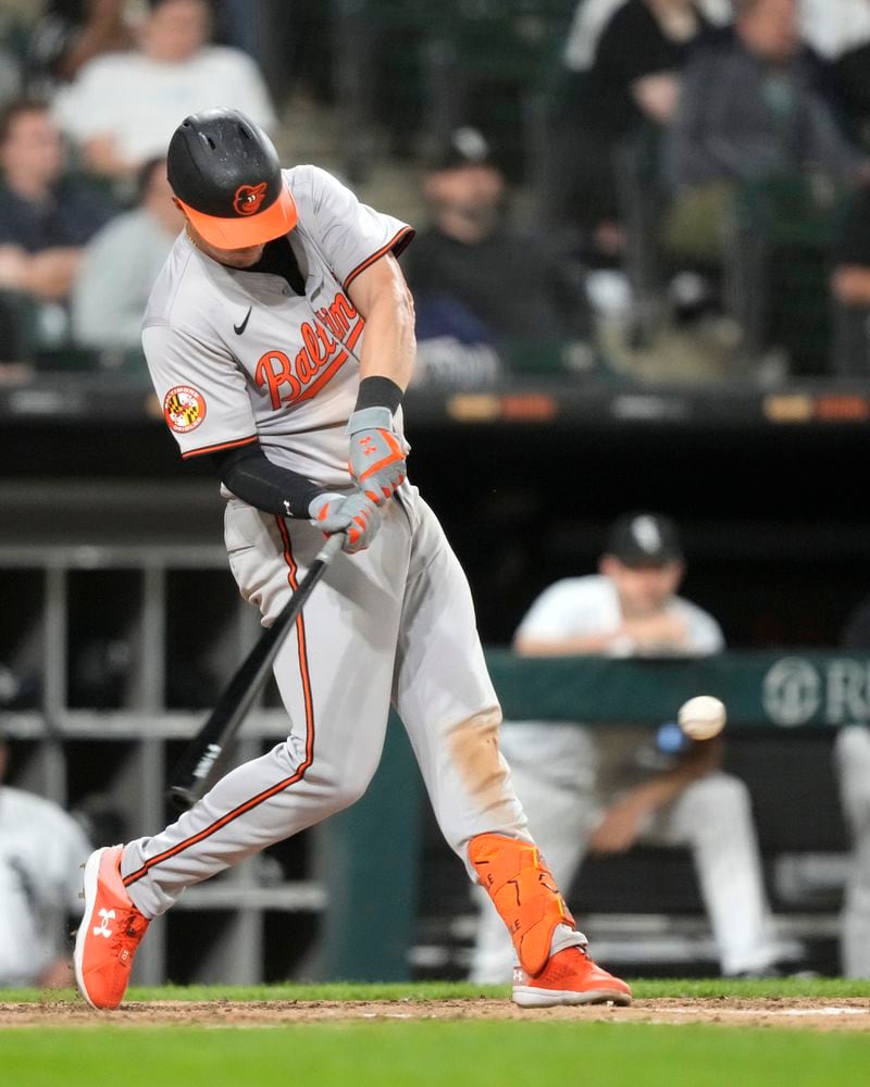 Baltimore Orioles' Ryan Mountcastle swings into his fourth hit of the night, a single off Chicago White Sox relief pitcher Jared Shuster, during the seventh inning of a baseball game Thursday, May 23, 2024, in Chicago. (AP Photo/Charles Rex Arbogast)