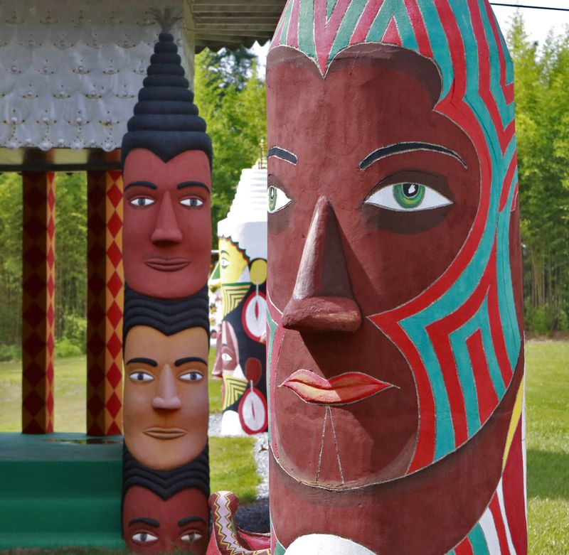 July 22,  2016 - Buena Vista, GA  - Painted totems depicting Pasaquoyans appear throughout the site.  Pasaquan is an art installation created by the late visionary artist Eddie Owens Martin in Buena Vista, Ga. The grounds features six buildings and 900 feet of cement fencing, all covered inside and out with colorful paintings. The site had fallen into disrepair, but starting in 2014 the Kohler Foundation began funding the restoration of the site, which has been given to Columbus State University to maintain when it reopens in October.   BOB ANDRES  / BANDRES@AJC.COM