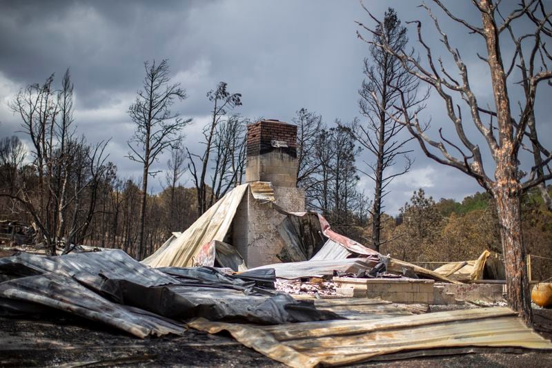 The remains of a house destroyed by the South Fork Fire are pictured in the mountain village of Ruidoso, N.M., Saturday, June 22, 2024. (AP Photo/Andres Leighton)