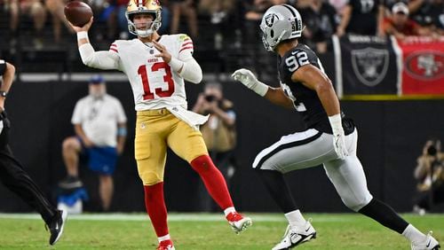 San Francisco 49ers quarterback Brock Purdy (13) throws against the Las Vegas Raiders during the first half of an NFL preseason football game, Friday, Aug. 23, 2024, in Las Vegas. (AP Photo/David Becker)