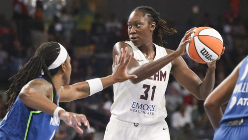 Atlanta Dream center Tina Charles (31) controls the ball against Minnesota Lynx forward Myisha Hines-Allen (22) during the first half at the Gateway Center Arena, Tuesday, Sept. 10, 2024, in Atlanta. (Jason Getz / AJC)

