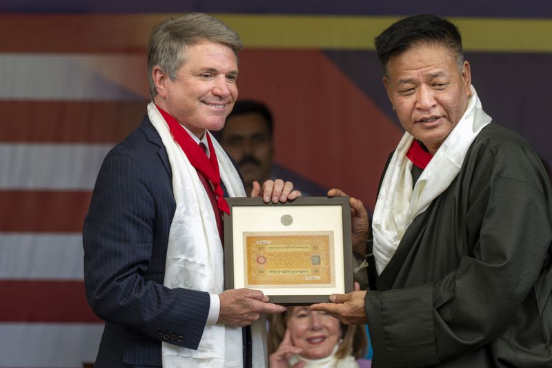 President of the Central Tibetan Administration, Penpa Tsering, right, presents currency of erstwhile independent Tibet to Republican Rep. Michael McCaul at a public event during which a US delegation led by McCaul was felicitated by the Tibetan exiled government officials at the Tsuglakhang temple in Dharamshala, India, Wednesday, June 19, 2024. (AP Photo/Ashwini Bhatia)