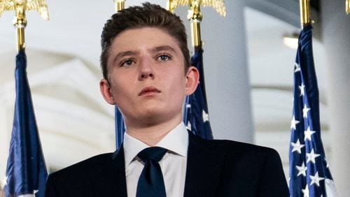 FILE - Barron Trump stands on the South Lawn of the White House on the fourth day of the Republican National Convention in Washington, Aug. 27, 2020. (AP Photo/Evan Vucci, File)