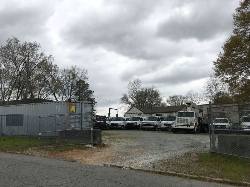 The land lot where Frances Zahn lived in her abandoned streetcar is used today as for parking by a mechanical contractor company. (Pete Corson / pcorson@ajc.com)