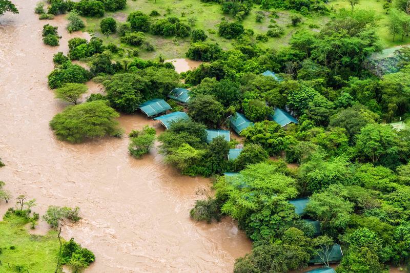 FILE - A lodge is visible in the flooded Maasai Mara National Reserve, which left dozens of tourists stranded in Narok County, Kenya, May 1, 2024. The impact of the calamitous rains that struck East Africa from March to May was intensified by a mix of climate change and rapid growth of urban areas, an international team of climate scientists said in a study. (AP Photo/Bobby Neptune, File)
