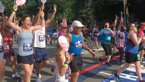 Bill Thorn crosses the finish line of the AJC Peachtree Road Race Thursday, July 4, 2019. As the race celebrated its 50th running, Thorn continued his status as the only person to have completed every Peachtree. His time was two hours, 17 minutes, 58 seconds. (Ken Sugiura/AJC)