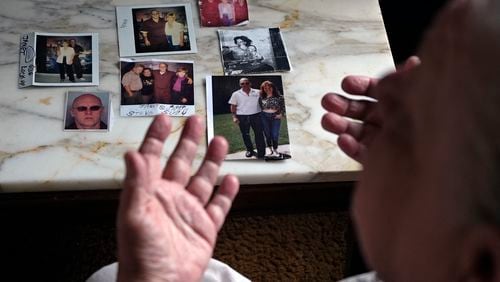 Suzy Patton shows old photos of her brother Steve Szarewicz, who insists he was wrongly convicted of a 1981 murder based on the testimony of four jailhouse informants on Tuesday, April 30, 2024 in her home in New Kensington, Pa. (AP Photo/Gene J. Puskar)