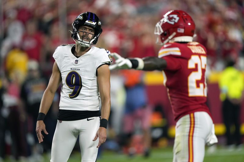 Kansas City Chiefs' Chamarri Conner, right, reacts to a missed field goal attempt by Baltimore Ravens kicker Justin Tucker (9) during the first half of an NFL football game Thursday, Sept. 5, 2024, in Kansas City, Mo. (AP Photo/Charlie Riedel)