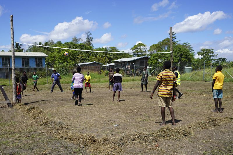 In this undated photo provided by UNICEF PNG, East Sepik massacre survivors play volleyball at a care center in Angoram, Papua New Guinea. (Noreen Chambers/UNICEF PNG via AP)