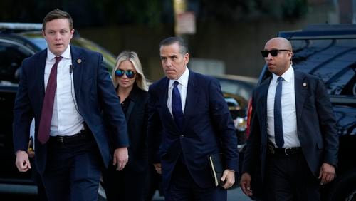 Hunter Biden, center, and his wife Melissa Cohen Biden, arrive in federal court for jury selection for his trial on felony tax charges Thursday, Sept. 5, 2024, in Los Angeles. (AP Photo/Jae C. Hong)