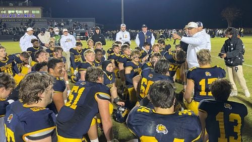 Prince Avenue Christian head coach Greg Vandagriff talks with his players after the team's 41-7 victory over Irwin County in the Class A Division I quarterfinals in Bogart on Nov. 24, 2023