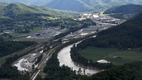 An aerial view of flood damage in the aftermath of Hurricane Helene, Saturday, Sept. 28, 2024, in Erwin, Tenn. (AP Photo/George Walker IV)