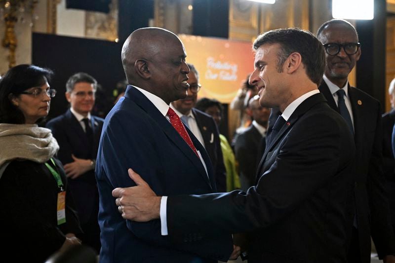 French President Emmanuel Macron greets Botswana's President Mokgweetsi Eric Keabetswe Masisi during the African Vaccine Manufacturing Accelerator conference, Thursday, June 20, 2024 in Paris. French President Emmanuel Macron is joining some African leaders to kick off a planned $1 billion project to accelerate the rollout of vaccines in Africa, after the coronavirus pandemic bared gaping inequalities in access to them. (Dylan Martinez/Pool via AP)