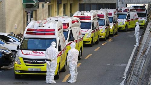 Ambulances carrying patients infected with the novel coronavirus arrive at a hospital in Daegu, South Korea.