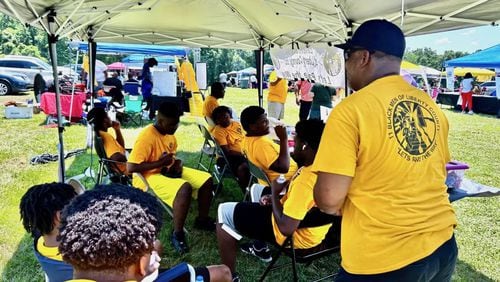 Members of Eleven Black Men of Liberty County, Inc. work raffle ticket sales at Hinesville's Juneteenth celebration, June 15, 2024. (Photo Courtesy of Robin Kemp/The Current GA)