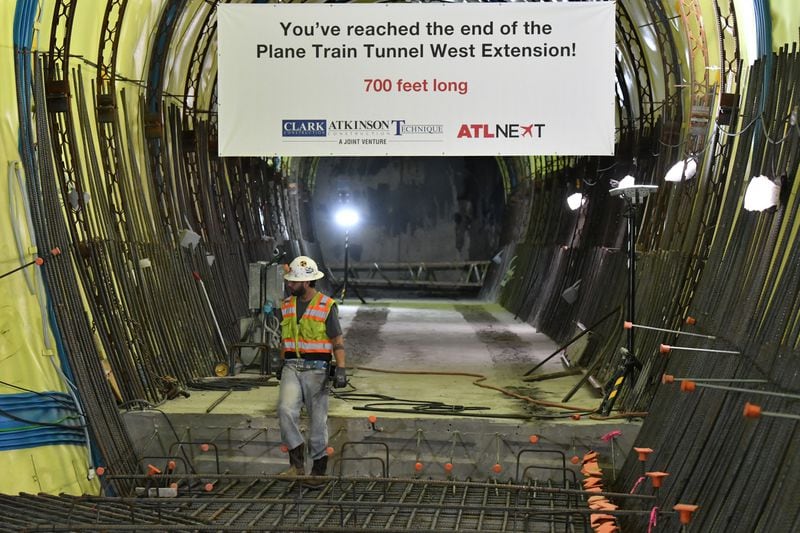 June 9, 2022 Atlanta - Construction crew work at a 700-foot-long tunnel under construction beneath Hartsfield-Jackson International . The Atlanta airport has for decades had a reputation in the aviation industry for having one of the most efficient layouts in the country, enabling passengers to quickly and easily connect between flights via parallel concourses linked by a single underground Plane Train line.  (Hyosub Shin / Hyosub.Shin@ajc.com)