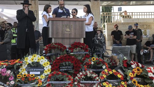 Jonathan Polin and Rachel Goldberg, parents, and sisters Orly and Leebie of killed US-Israeli hostage Hersh Goldberg-Polin whose body was recovered with five other hostages in Gaza, speak during the funeral in Jerusalem, Monday, Sept. 2, 2024. (Gil Cohen-Magen/Pool via AP)