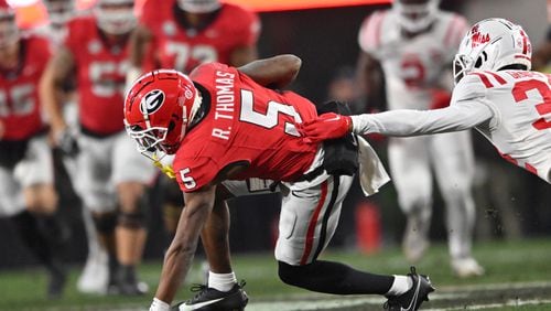 Georgia wide receiver Rara Thomas (5) makes a move after a catch during the first half in an NCAA football game at Sanford Stadium, Saturday, November 11, 2023, in Athens. Georgia won 52-17 over Mississippi. (Hyosub Shin / Hyosub.Shin@ajc.com)